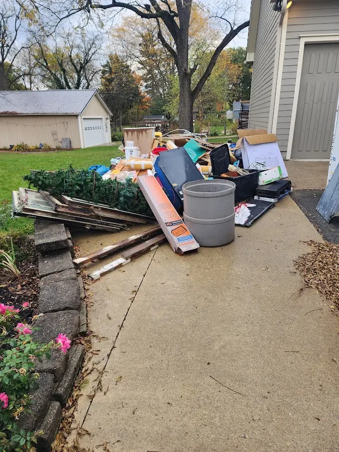 Dumpster being loaded with debris for Commercial Dumpster Rental in Worth
